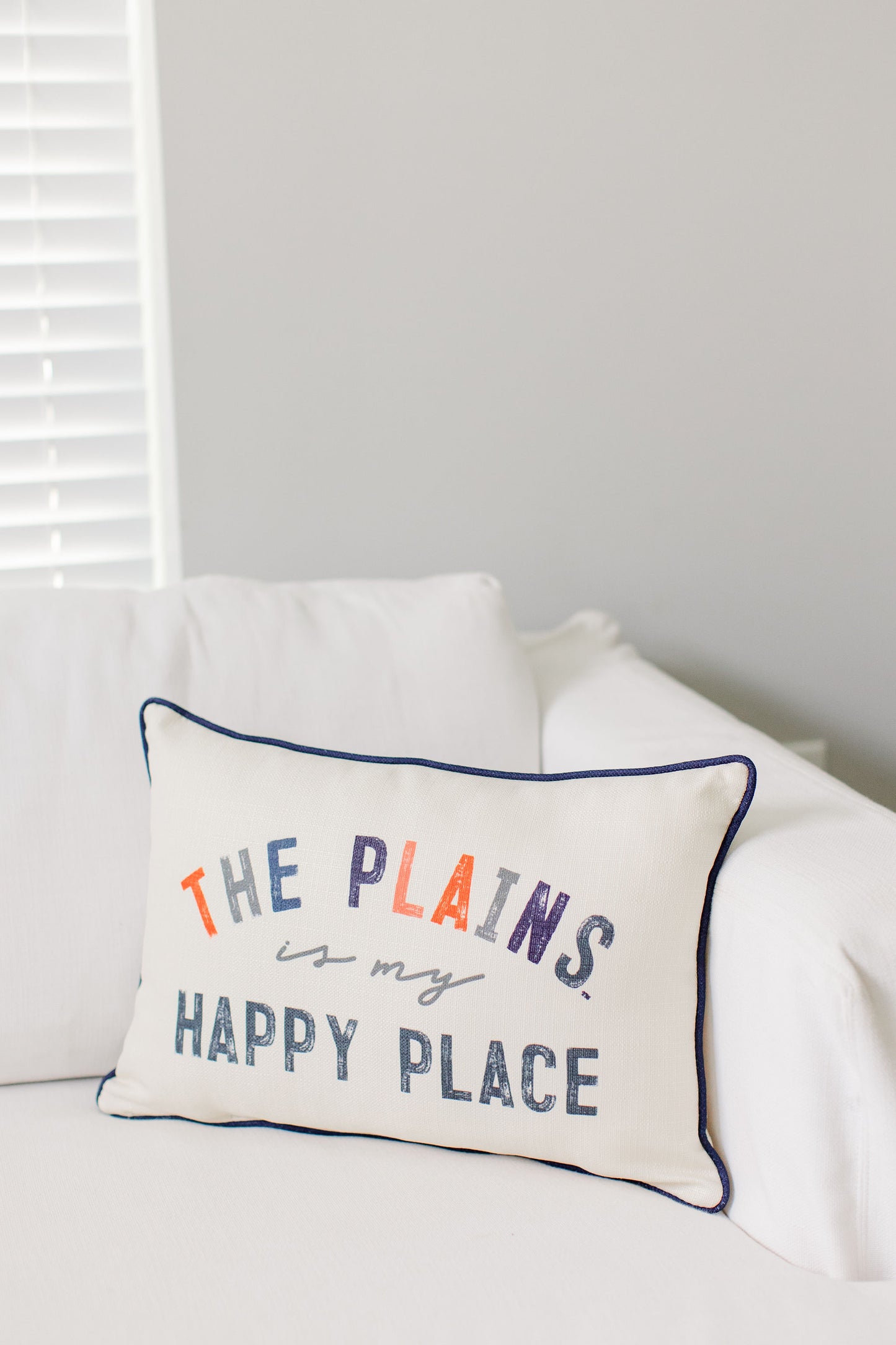 THE PLAINS IS MY HAPPY PLACE PILLOW WITH NAVY PIPING