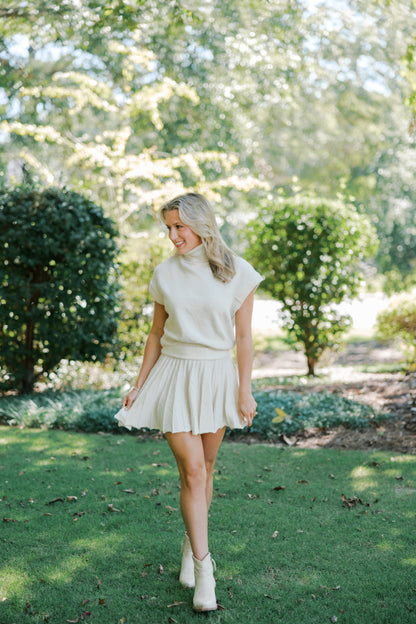Cream Turtleneck Crop Top and Pleated Skirt Set