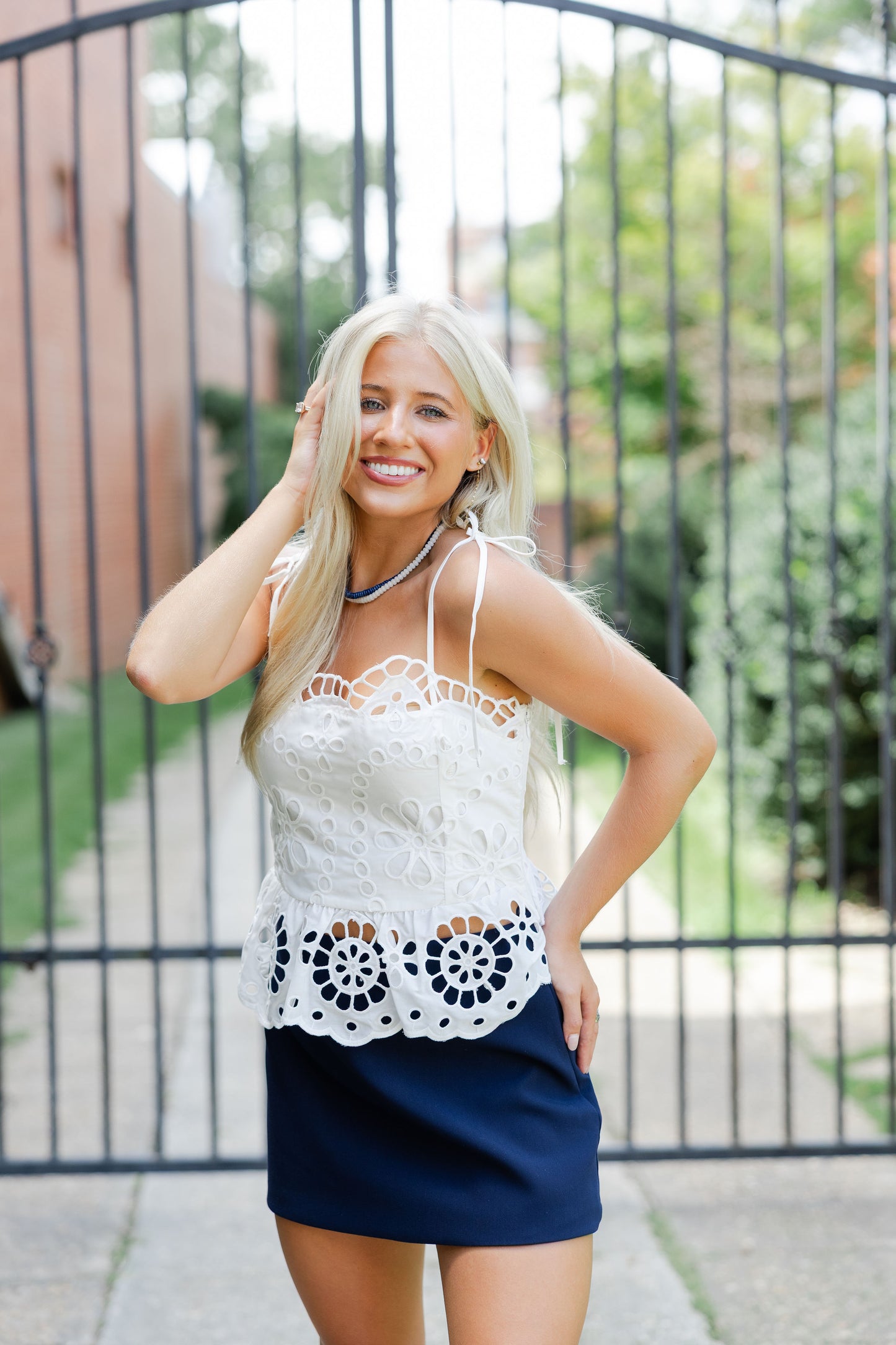Embroidered Eyelet Peplum Top